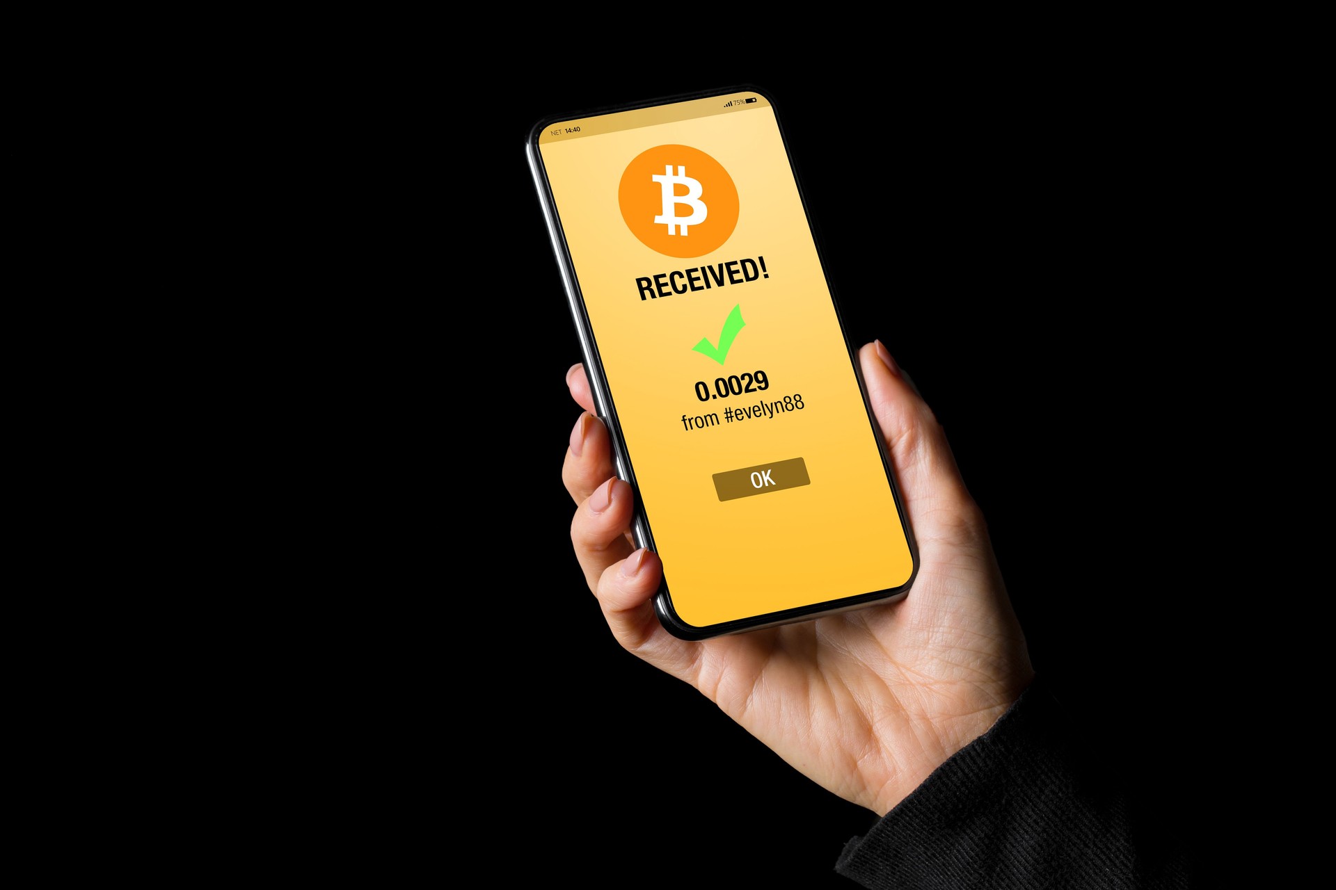 Person viewing bitcoin app on mobile phone showing incoming transfer